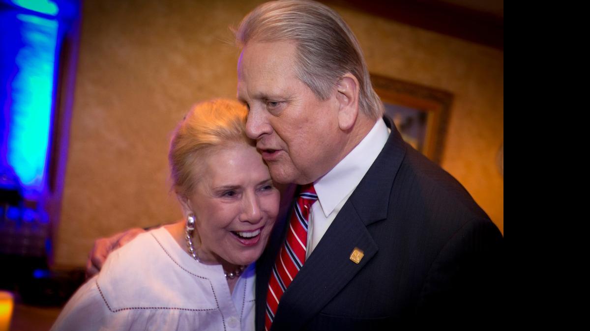 
Arlington Mayor Robert Cluck hugs Klata Peacock at his election night watch party at River Legacy Living Science Center on Saturday. 
