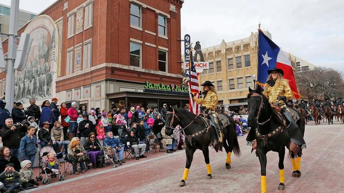 Members of rodeo’s legendary Gay family lead the parade from the Tarrant County Courthouse, Megan and Summer Gay (l2r), followed by the Fort Worth Police Mounted Patrol. A annual tradition, the Fort Worth Stock Show All Western Parade was held in downtown Fort Worth, Saturday, January 16, 2016.