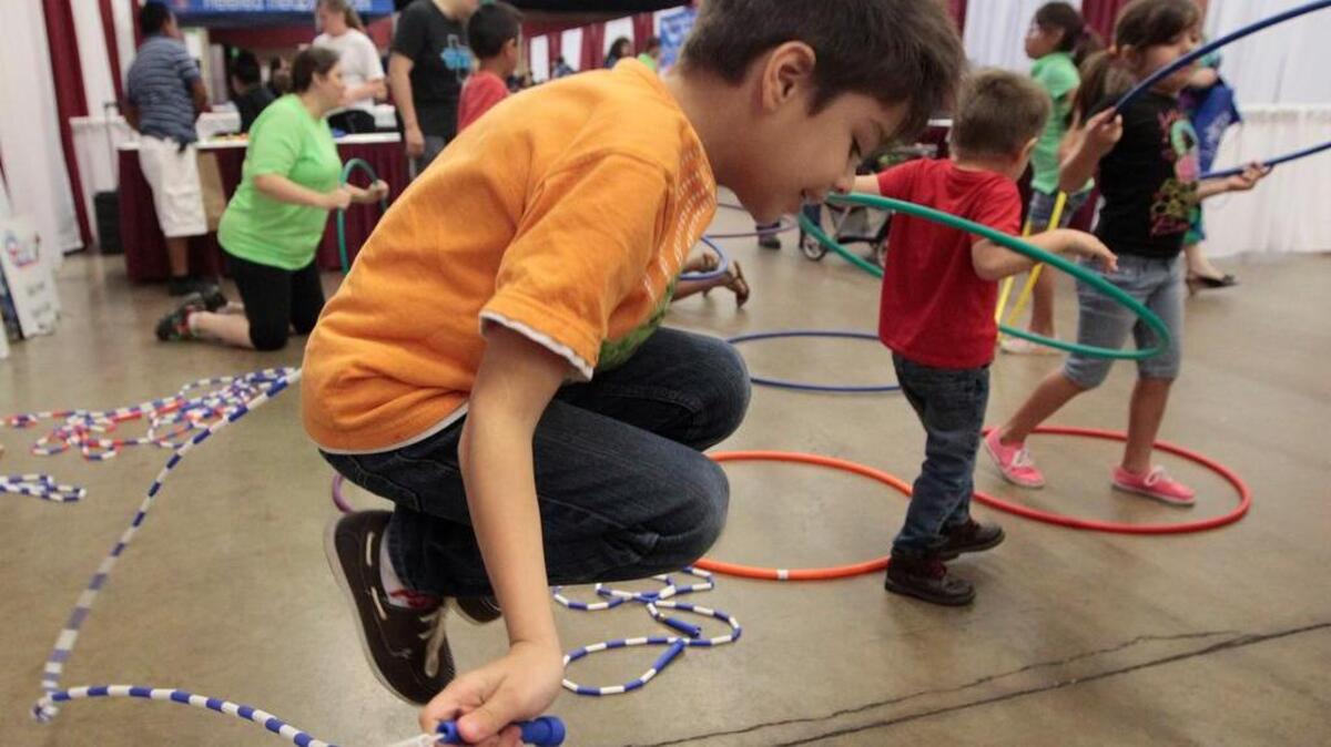 Santiago Calzadillas, 7, jumps rope at the Fit Worth Healthy City Initiative booth at the 15th Annual Hispanic Wellness Fair on Saturday, August 3, 2013 at the Will Rogers Memorial Center.
