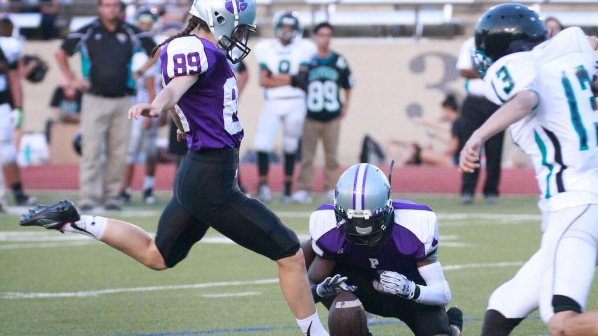 
Reilly Fox (89), female kicker for Paschal High, kicks a extra point Saturday in the first quarter against Dallas Molina. 
