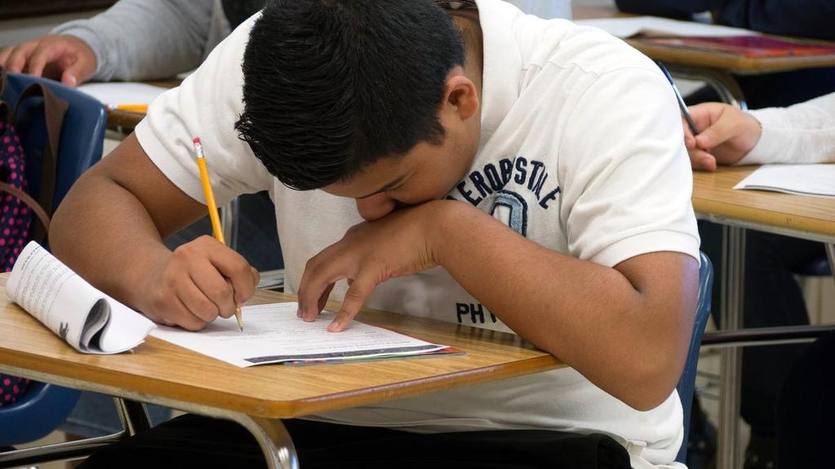 Eduardo Montoya works on a vocabulary activity designed to help students pass standardized tests.