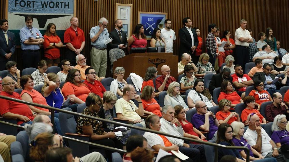 A standing room only crowd, with more in an overflow room viewing a remote video feed, attend a Fort Worth City Council meeting at City Hall, Tuesday, Aug. 15, 2017. More than 70 people are signed up to speak Tuesday night on the council proposal filed by District 2 Councilman Carlos Flores. The proposal that directs the city to join a lawsuit that opposes the so-called ”sanctuary cities” law.