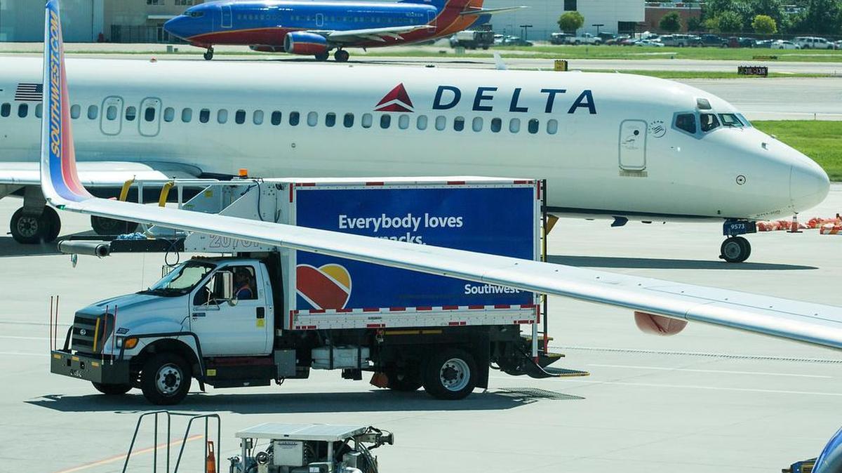 Delta, Southwest jets taxi at Dallas Love Field.