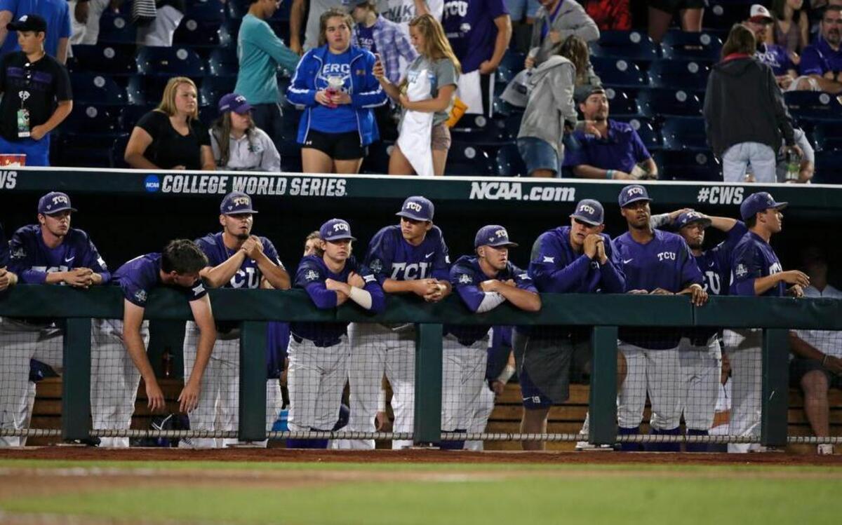 The TCU dugout reacts after losing to Florida in an NCAA College World Series baseball elimination game in Omaha, Neb., Saturday, June 24, 2017. Florida won 3-0.