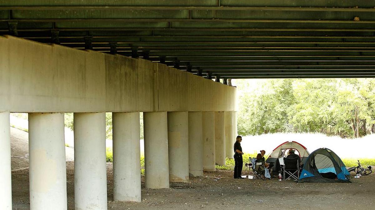 A homeless camp springs up under a bridge near downtown Fort Worth in 2013.