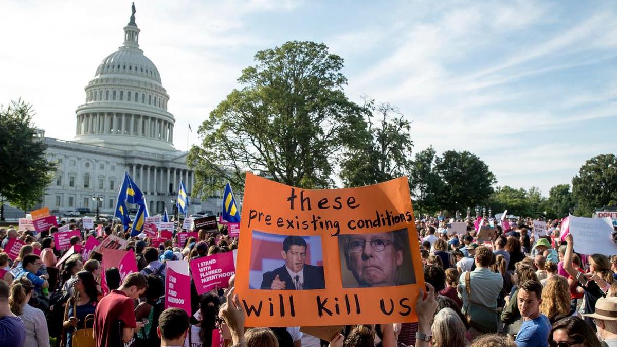 People rally against the Senate Republican healthcare bill on the East Front of the Capitol on Wednesday in Washington, D.C.