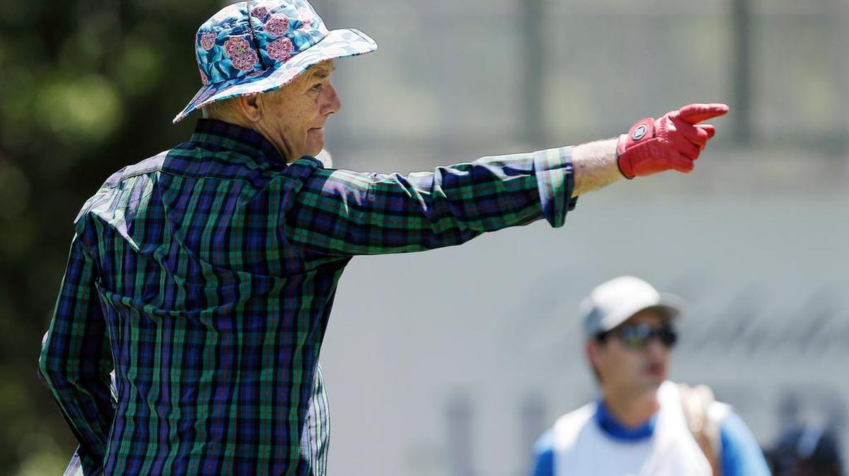 Comedian Bill Murray playfully points to a spectator on the third tee box Wednesday during the Dean & DeLuca Invitational ProAm at Colonial Country Club in Fort Worth.