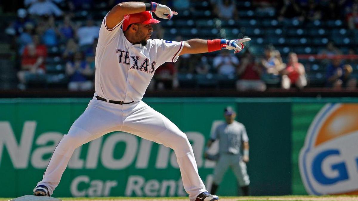 Texas Rangers shortstop Elvis Andrus gestures to teammates Thursday after his seventh-inning RBI double against the Colorado Rockies at Globe Life Park in Arlington. The temperature hit 103 at nearby DFW Airport.