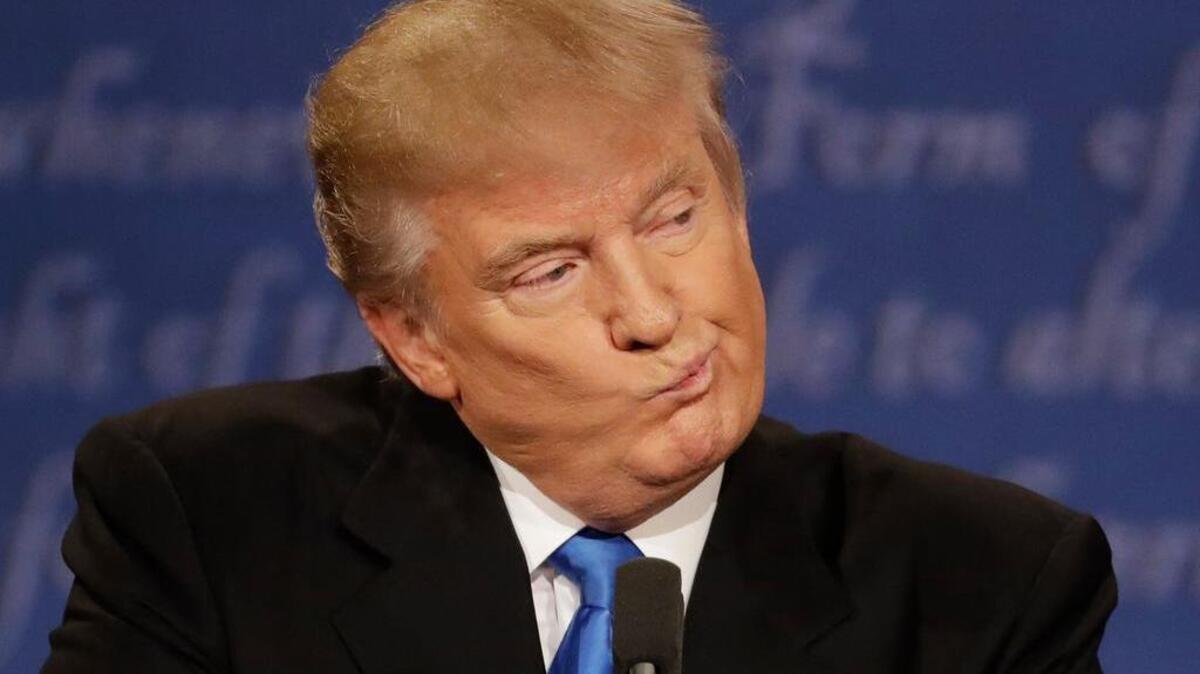 Republican presidential nominee Donald Trump listens to Democratic presidential nominee Hillary Clinton during the presidential debate at Hofstra University in Hempstead, N.Y., Monday, Sept. 26, 2016.