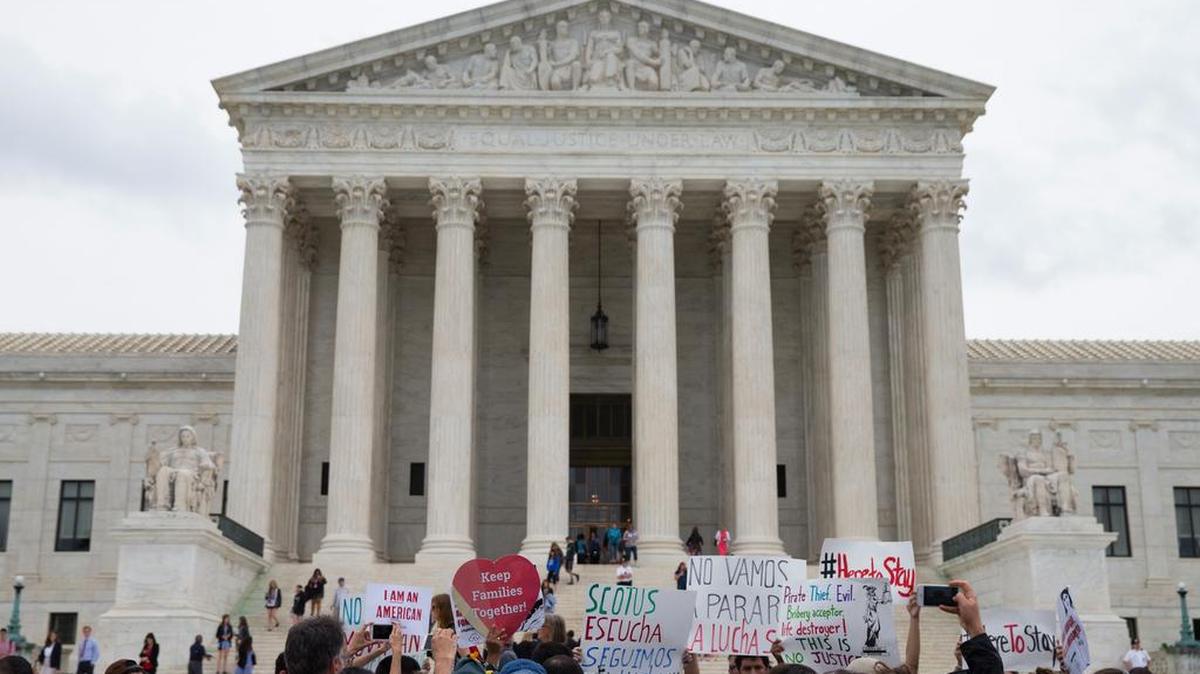 Demonstrators gathered outside the Supreme Court in Washington Thursday. In a major victory for affirmative action, a divided Supreme Court upheld the University of Texas admissions program that takes account of race.