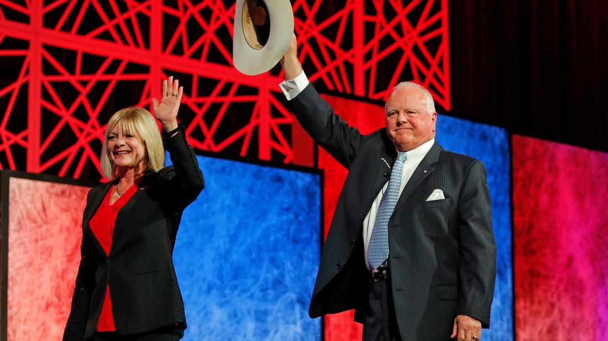 Texas Agriculture Commissioner Sid Miller walks off with his wife Debra after he speaks at the Republican Party of Texas state convention at the Kay Bailey Hutchison Convention Center in Dallas, May 2016.