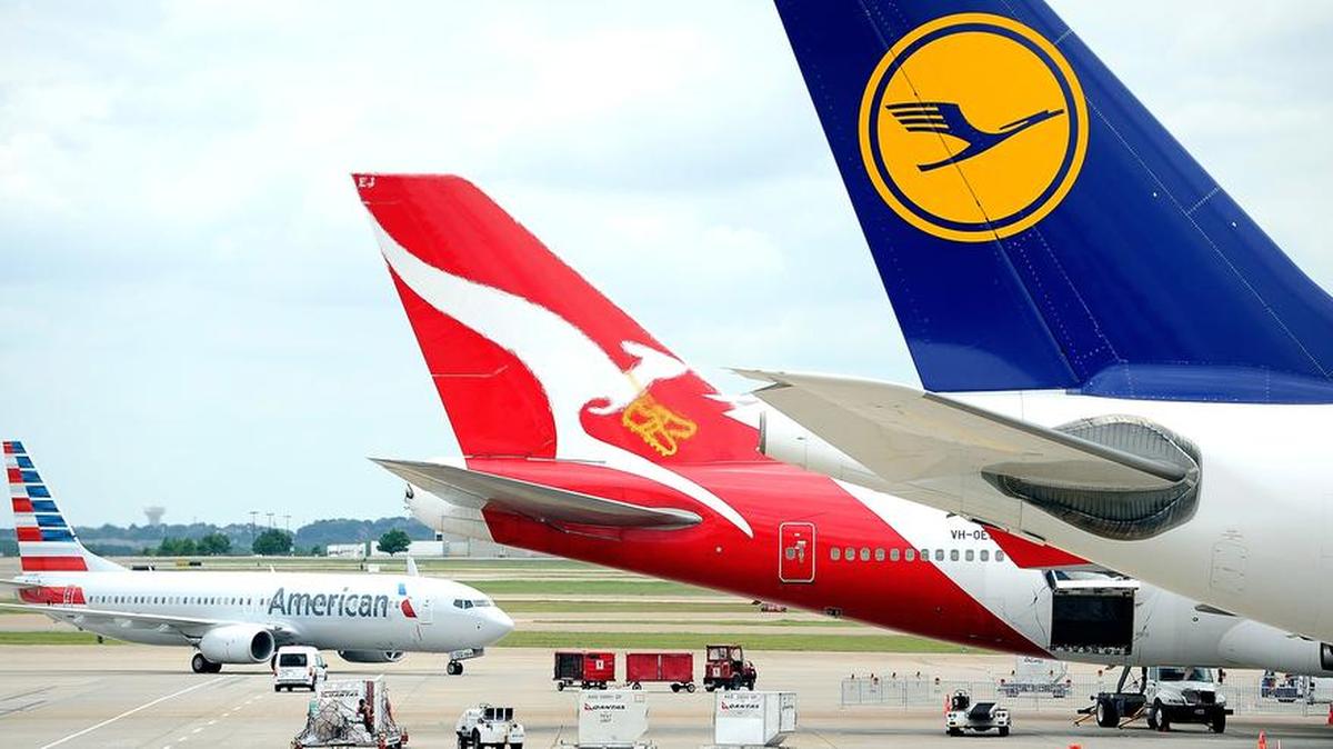 International carriers, American, left, Qantas, center, and Lufthansa, right, at DFW Airport’s Terminal D in 2014.