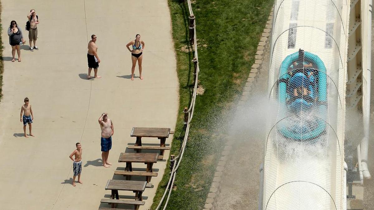 Riders are propelled by jets of water as they go over a hump while riding a water slide called "Verruckt" at Schlitterbahn Waterpark in Kansas City, Kan.