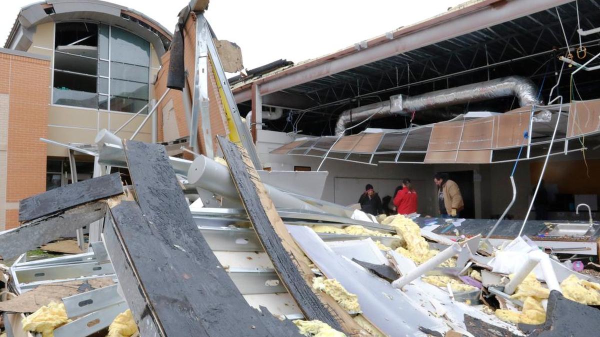 Volunteers salvaged what they could from the storm-damaged Donald T. Shields Elementary School in Red Oak on Dec. 28, two days after a tornado swept through.
