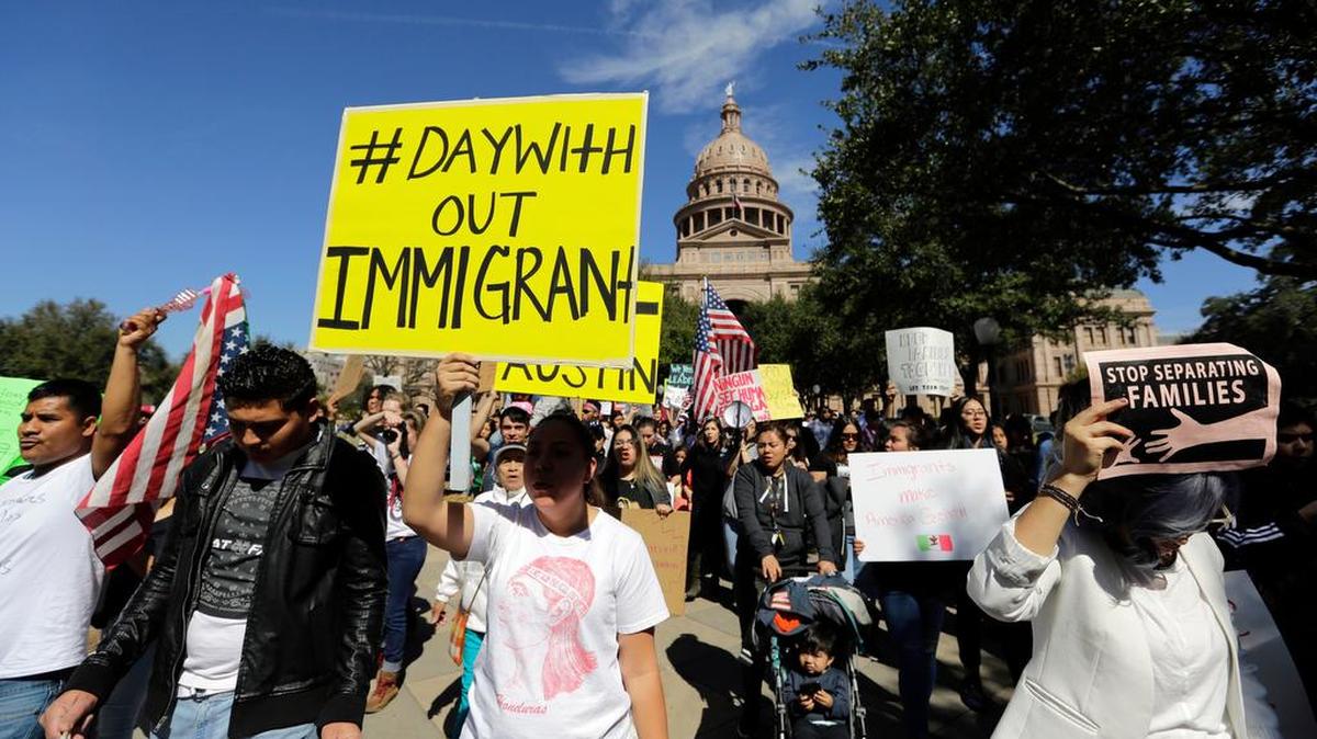 A group marches away from the Texas Capitol during an immigration protest Thursday in Austin.