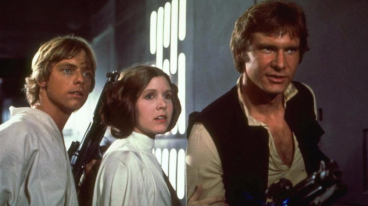 Mark Hamill, Carrie Fisher and Harrison Ford, from left, starred in the 1977 film Star Wars.