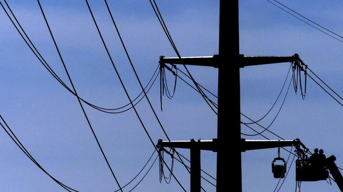 Contractors work on Oncor electric distribution lines. The company serves 91 counties in north and west Texas.