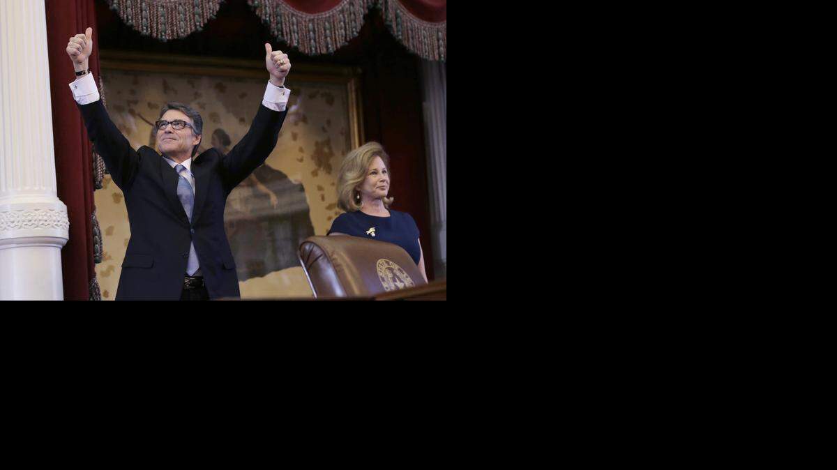 
 Gov. Rick Perry, shown with wife Anita, gave a farewell speech to the Legislature on Thursday.
