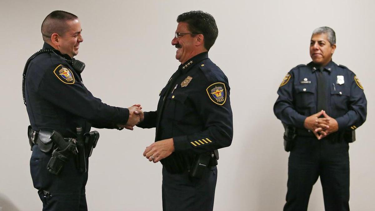 Officer Sergio Guadarrama with Jeff Halstead (right).