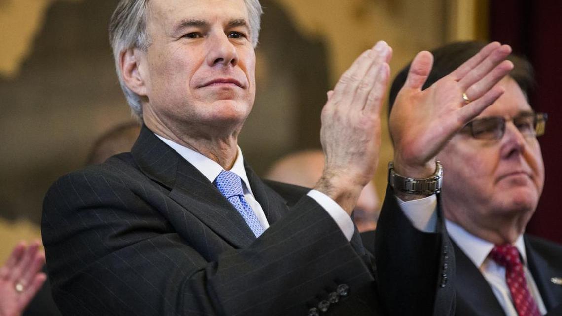 Gov. Greg Abbott, joined by Lt. Gov. Dan Patrick, right, applauds in the Texas House during the early days of the 2015 legislative session.