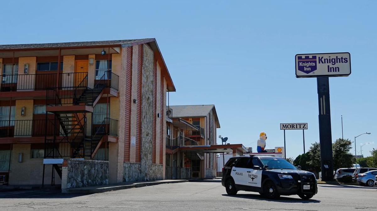 A police car leaves the Knights Inn near Las Vegas Trail in west Fort Worth last month.