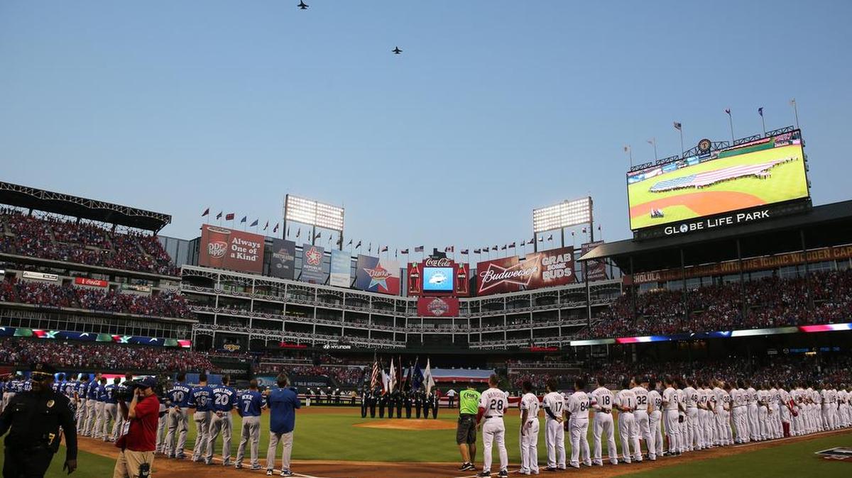 Air Force F-16 jets from Naval Air Station Joint Reserve Base Fort Worth perform a flyover before game 3 of the American League Division Series between the Toronto Blue Jays and the Texas Rangers Oct. 11 at Globe Life Park in Arlington.