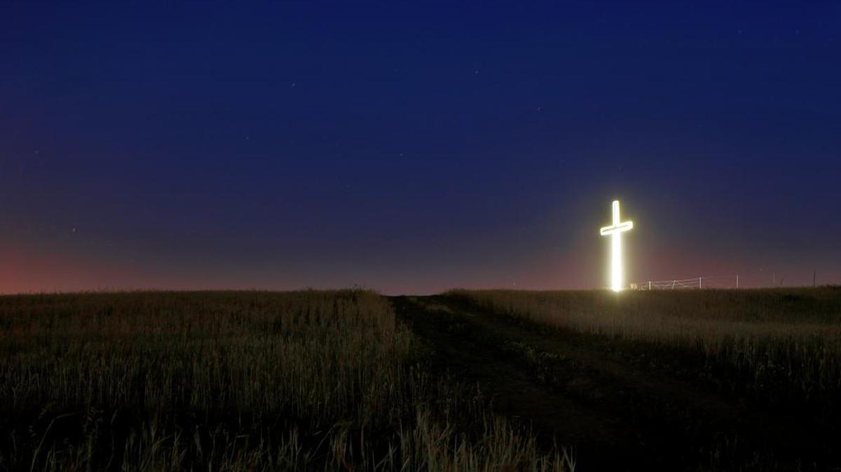 Stars shine in the sky over the giant illuminated cross of “Panagia Chrisospiliotissa”, a Christian Orthodox monastery in Deftera, a suburb outside the capital, Nicosia, Cyprus, Thursday, April 28, 2016.