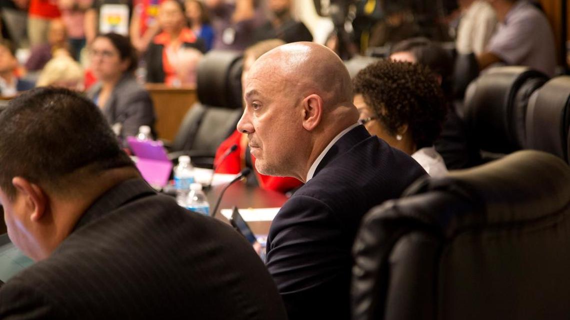 Superintendent Kent Scribner, center, and Fort Worth school board members listen to public input on transgender guidelines during a meeting in May.