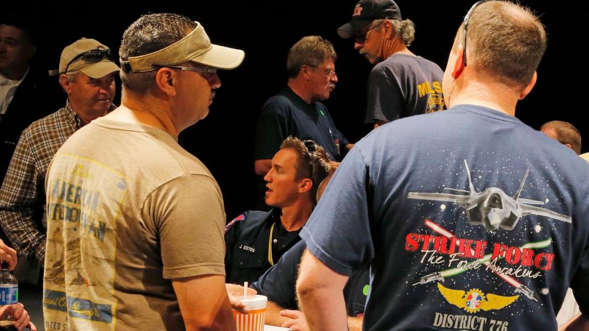 Union members talk after counting votes as members of the International Association of Machinist and Aerospace Workers at Lockheed Martin Aerospace gather at Will Rogers Memorial Auditorium and vote to authorize a possible strike as they continue to negotiate a new contract, Saturday, June 18, 2016.