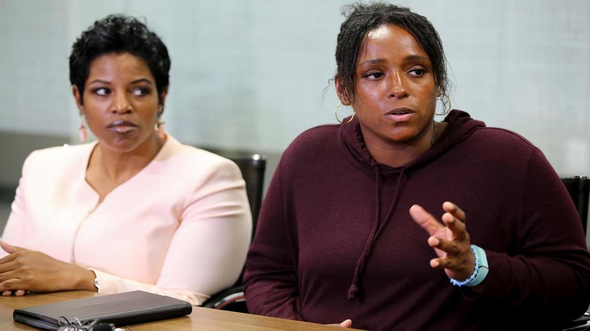 Latasha Nelson, right, speaks at a news conference with attorney Kim T. Cole, left, on Thursday, July 13, 2017, at the Next Generation Action Network in Dallas. Nelson says police in the Dallas suburb of Arlington offered to drop charges against her two teenage sons in exchange for a cellphone video she shot that allegedly shows an officer needlessly pushing her older son to the ground and arresting him.