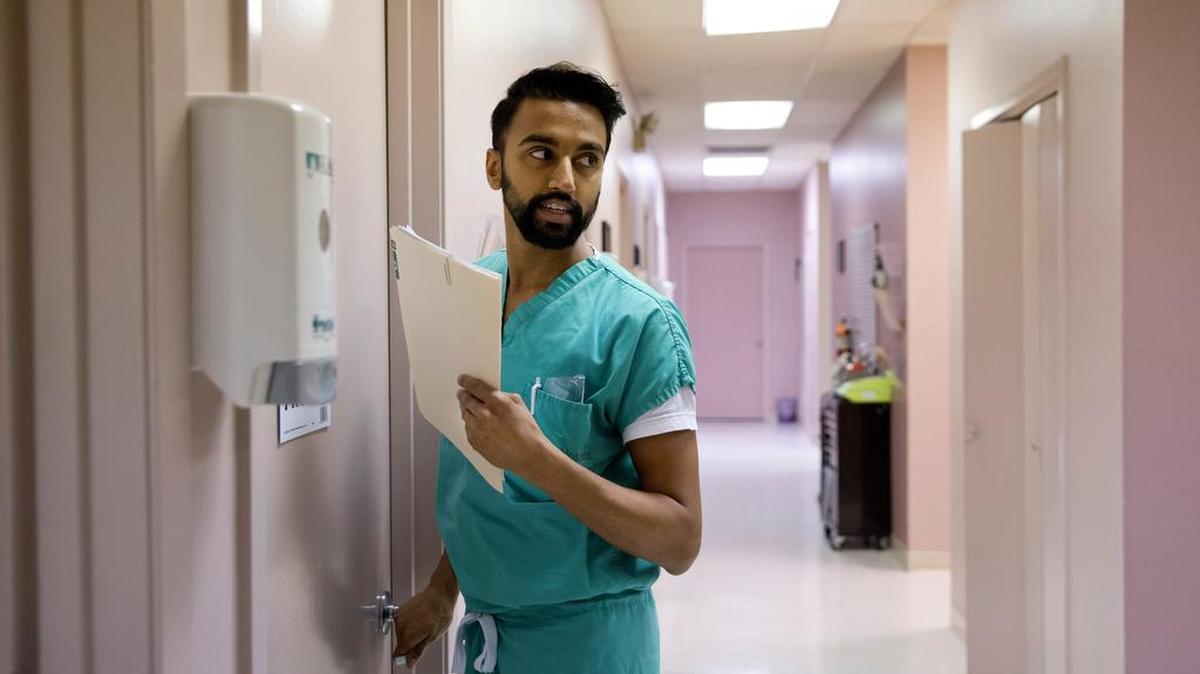 Dr. Bhavik Kumar, 31, enters a room to perform a first trimester abortion at a San Antonio clinic belonging to Whole Woman's Health, one of the few abortion providers left in Texas.