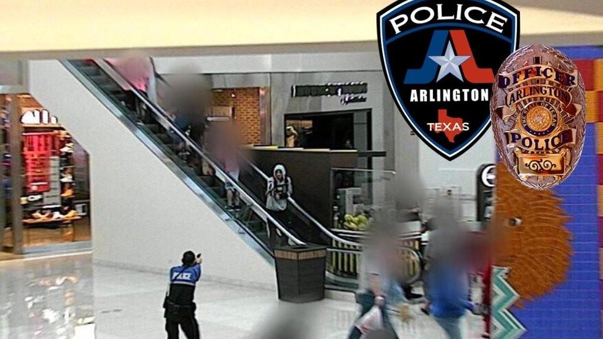 A photo released by Arlington police shows the suspect raising an imitation firearm shortly before the shooting.