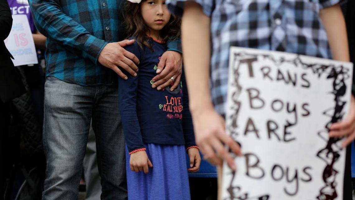 Libby Gonzales stands with her father, Frank Gonzales, as she joins other members of the transgender community during a rally on the steps of the Texas Capitol, Monday, March 6, 2017, in Austin, Texas.