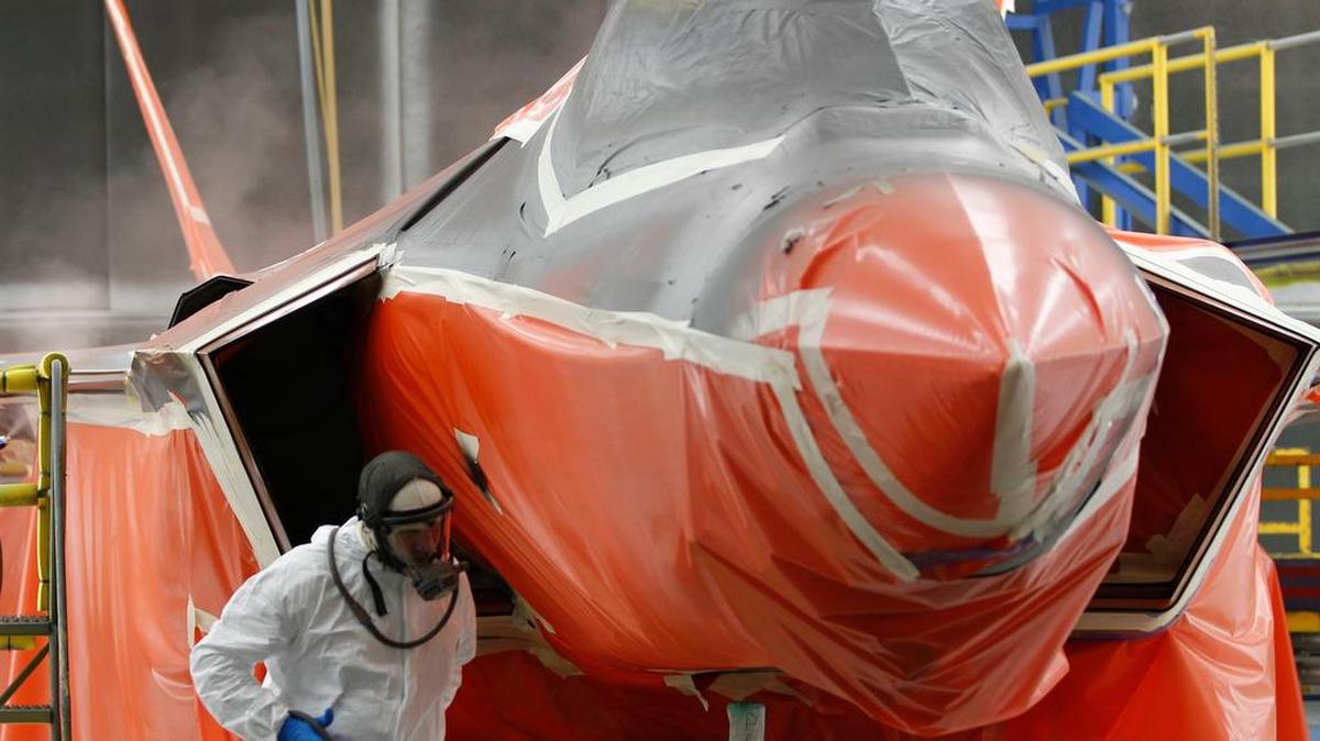 
Painter Ben Early sprays coatings on a F-35 in the finishing area at Lockheed Martin Aeronautics in Fort Worth.
