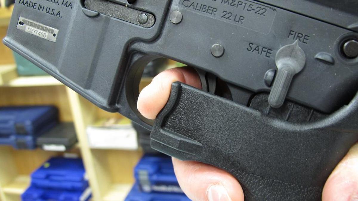 An employee of North Raleigh Guns demonstrates how a "bump" stock works at the Raleigh, N.C., shop in 2013. The gunman who unleashed hundreds of rounds of gunfire on a crowd of concertgoers in Las Vegas on Monday, Oct. 2, 2017, attached what is called a "bump-stock" to two of his weapons, in effect converting semiautomatic firearms into fully automatic ones.