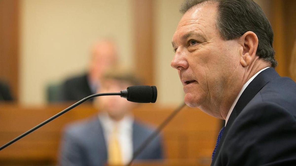 Texas Department of Family and Protective Services Commissioner Hank Whitman testifies Tuesday at a public hearing of the House of Representatives Committee on Human Services.