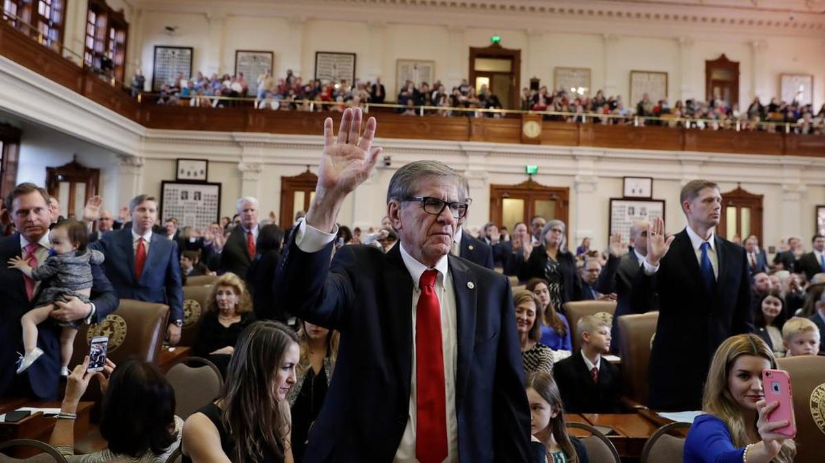 Texas Rep. Phil Stephenson, R-Wharton, center, and other lawmakers are sworn in Tuesday during the beginning of the 85th Texas Legislative session at the Texas State Capitol in Austin.
