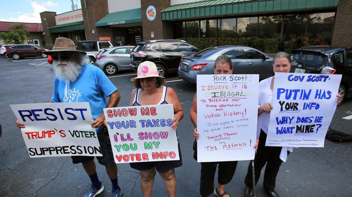 Protesters demonstrate in front of the Orange County Supervisor of Elections office, in Orlando, Fla. Monday.
