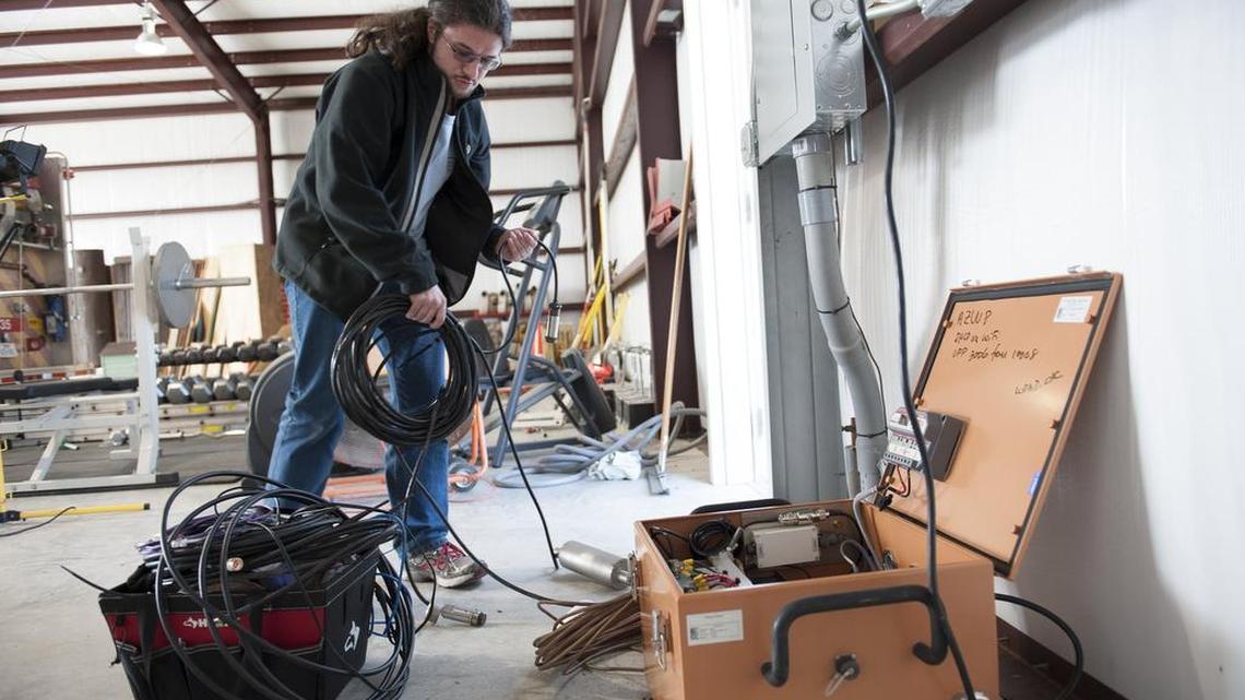 A Southern Methodist University researcher checks seismic equipment monitoring North Texas earthquake activity last year.