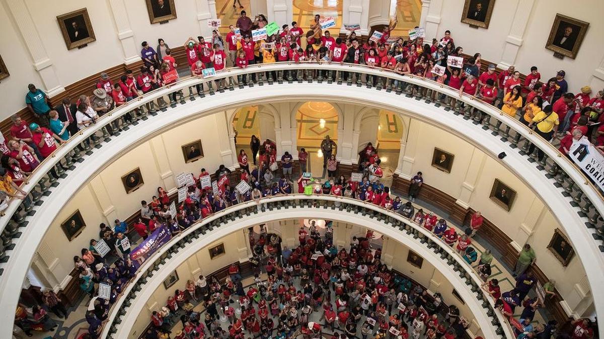 Hundreds of protesters line the balconies of the state Capitol rotunda in Austin the last day of the legislative session, to protest Senate Bill 4.