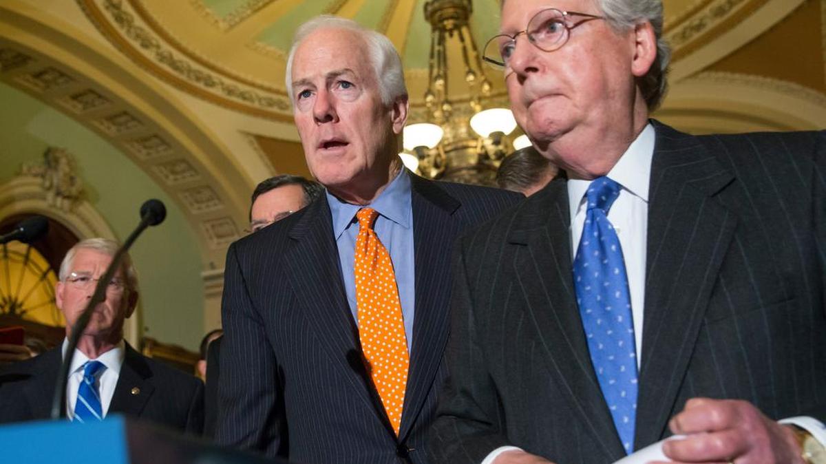 Senate Majority Whip John Cornyn, R-Texas, left, and Majority Leader Mitch McConnell, R-Ky., speak with reporters Tuesday about the Supreme Court nomination.
