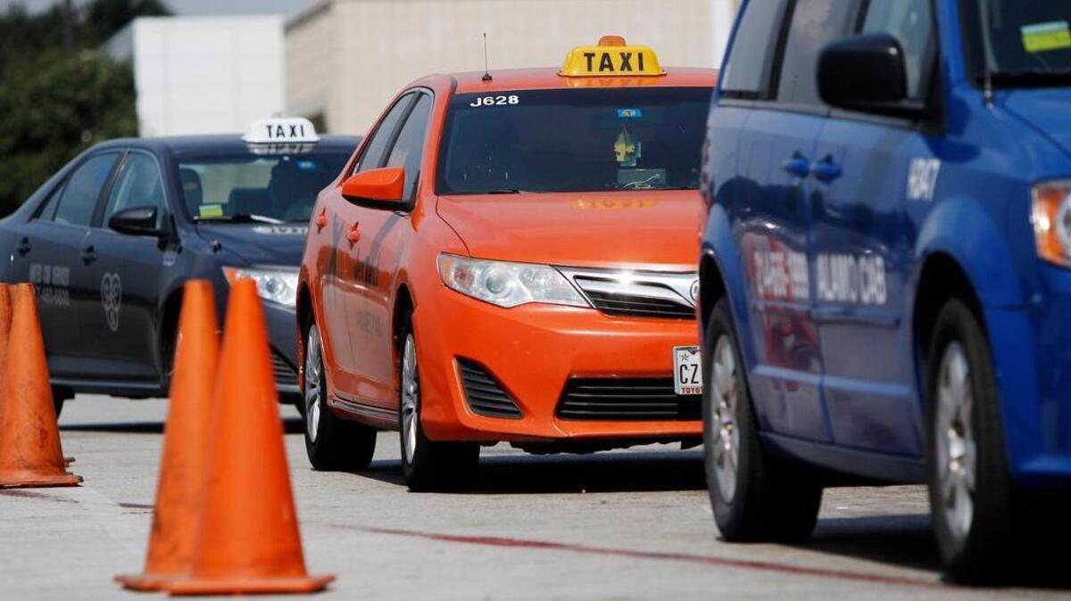 Taxis line up for riders at Dallas/Fort Worth Airport.
