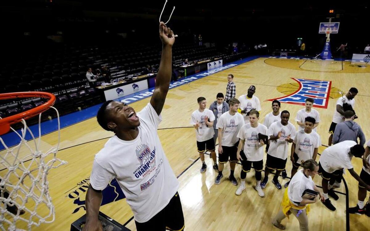 Texas Wesleyan’s Ryan Harris celebrates while cutting a piece of the net after winning the NAIA basketball national championship game against Life University on Tuesday, March 21, 2017, in Kansas City, Mo. Texas Wesleyan won 86-76.