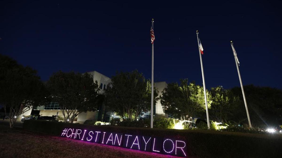 Signs placed outside the Arlington police headquarters during the protest of the fatal shooting of burglary suspect Christian Taylor.
