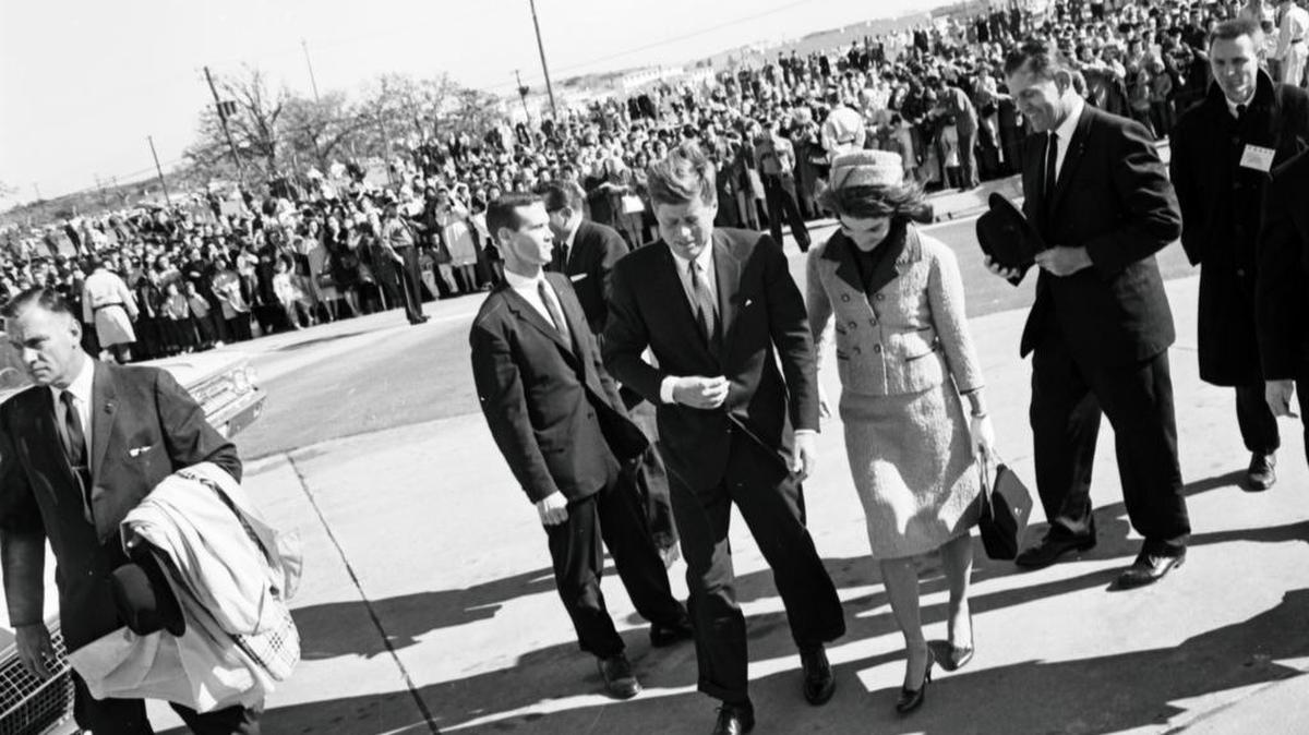 President and Mrs. John F. Kennedy, hand-in-hand, leaving Carswell Air Force Base for Dallas, Nov. 22, 1963