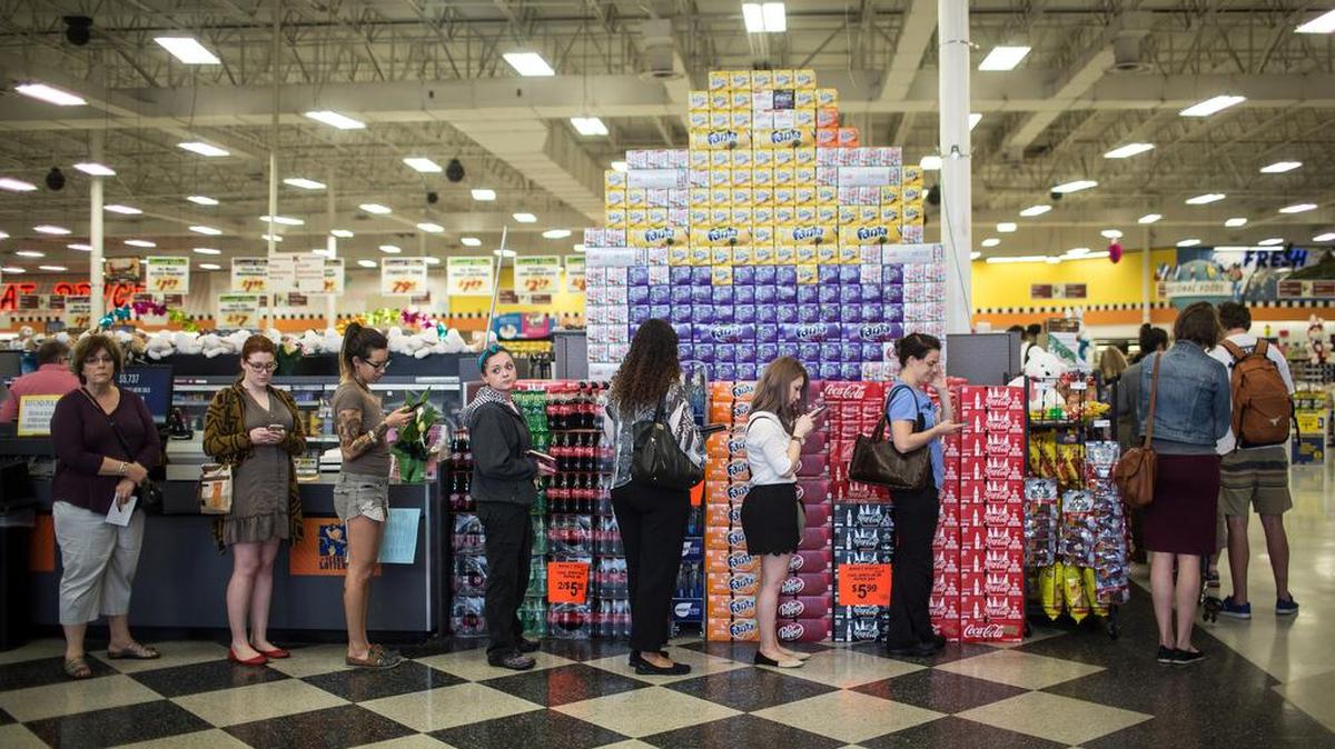 Voters wait to cast ballots in an Austin grocery store in a 2016 election.