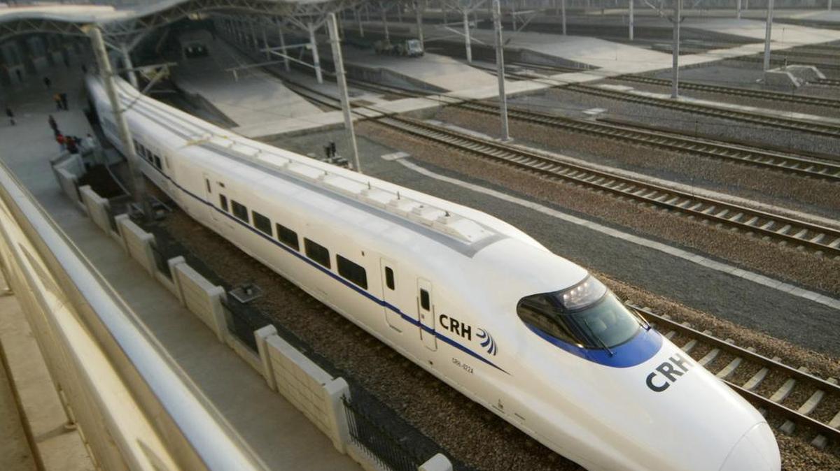A China Railway high-speed bullet train heads out of the Shanghai South Railway Station in Shanghai, China.