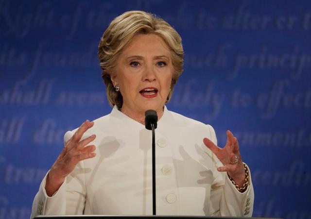 Democratic presidential nominee Hillary Clinton speaks to Republican presidential nominee Donald Trump during the third presidential debate at UNLV in Las Vegas, Wednesday, Oct. 19, 2016.