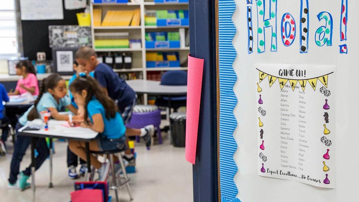 A sign on the door welcomes students to in a Mesquite school in 2016.