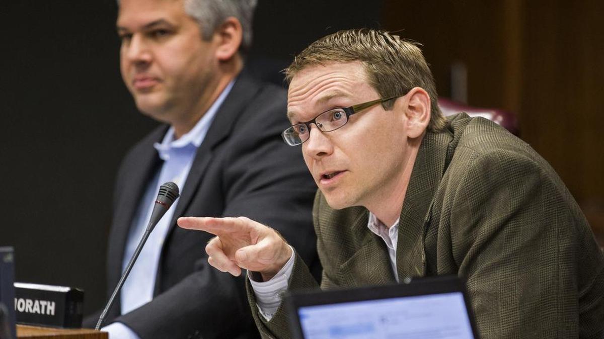 Mike Morath, right, asks a question to attorneys before the DISD board of trustees meets in closed session on Monday, February 16, 2015 at DISD Headquarters in Dallas, Texas.
